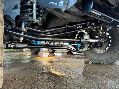 Installed view of BAD AXE RADS steering system on Dodge Ram front axle