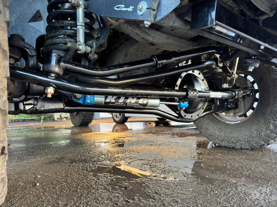 Installed view of BAD AXE RADS steering system on Dodge Ram front axle